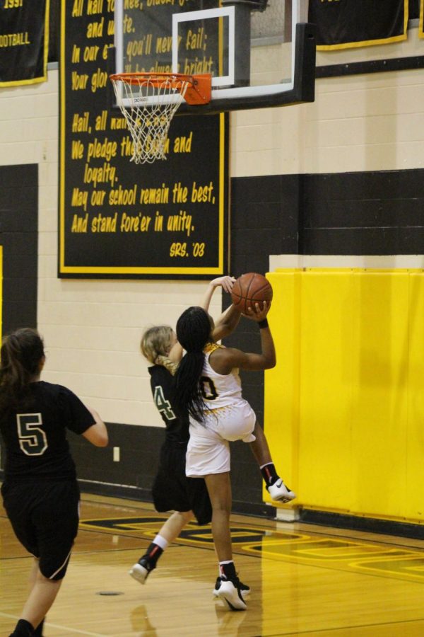 Rakasia Buhl goes up for a lay-up during the district opener again Rappaport. 