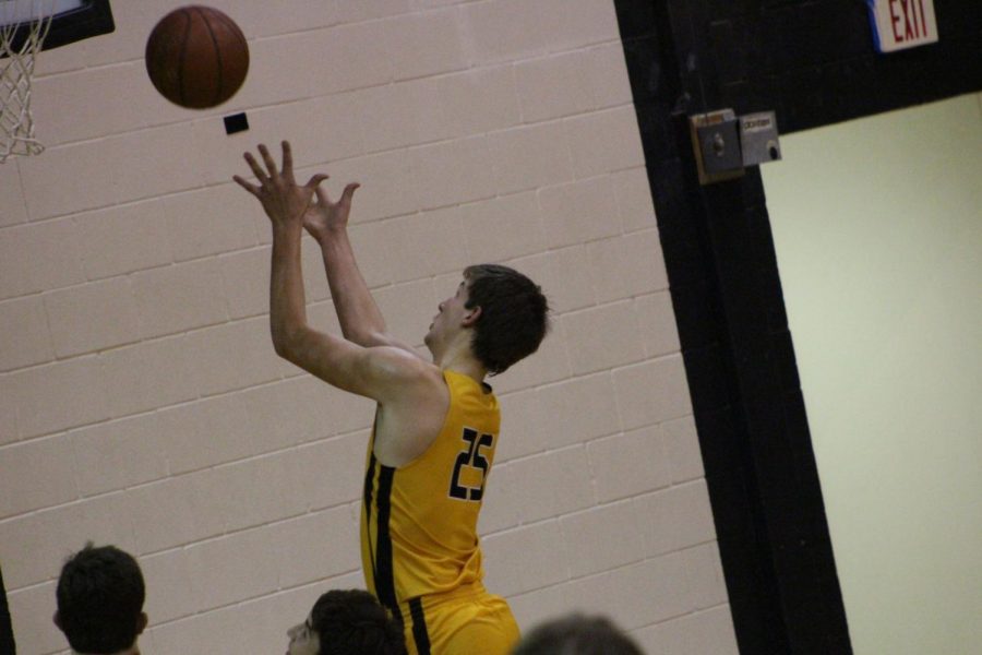 Brady Hering goes up for a rebound against Crawford Friday night. 