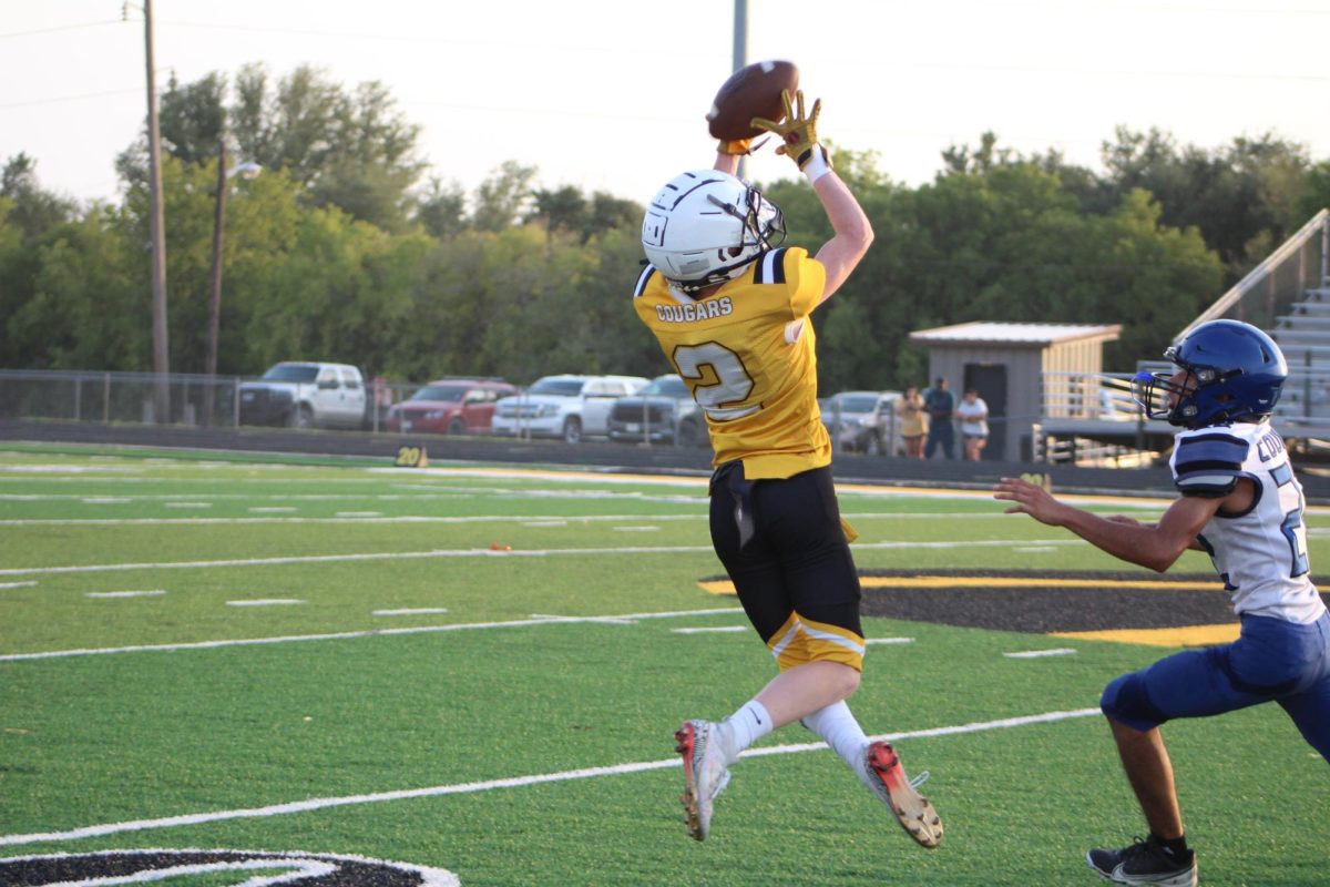 Dustin Reaux goes up for a catch during the Cougars loss last Thursday night. 