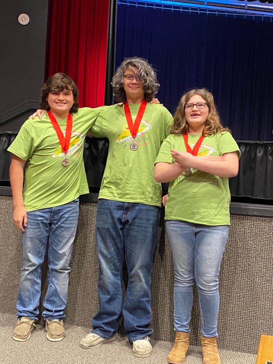 Rufus Redington, Peyton Williams, and Aydin Phillips pose with their medals of All-Star cast from the MS One Act Play. 