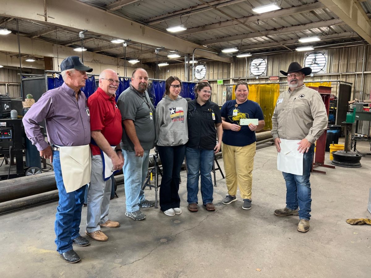 Mr. Benson, Ms. Teel and Mrs. Hudgins accepts a check from the Rosebud chapter of the Masons organization. 