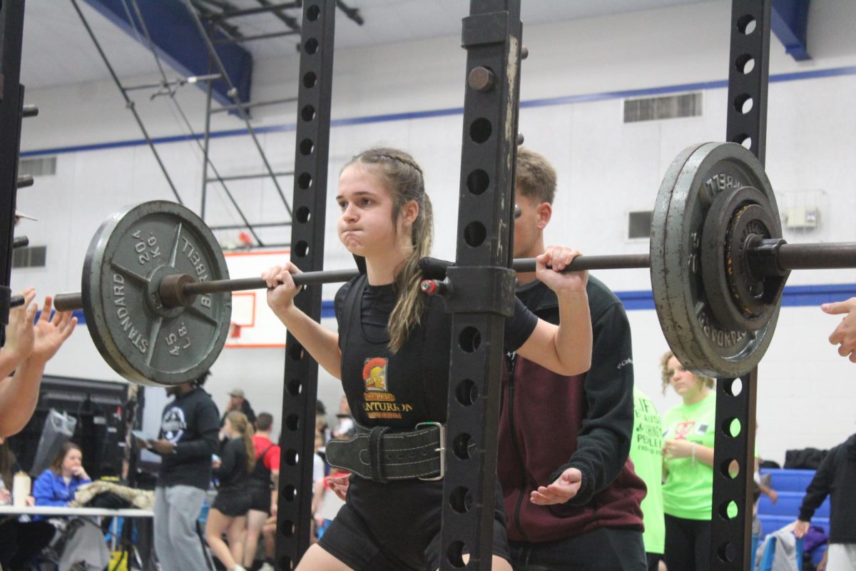 Brooklyn Ballard performs a textbook squat at a meet. 