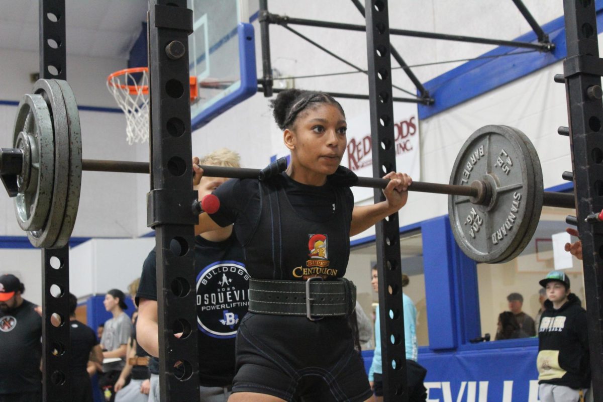 Lakia Cummings squats at a meet earlier in the season. 