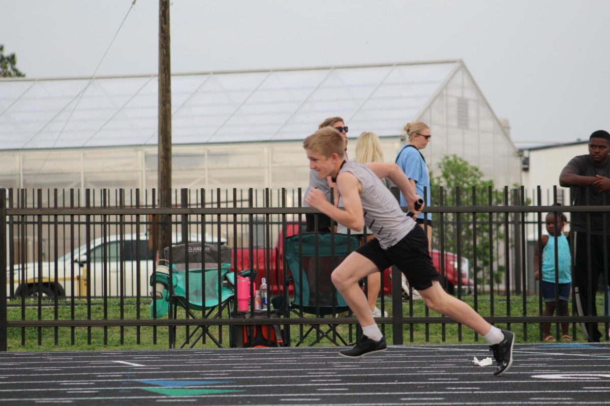 Drake Jahns starts the relay race. 