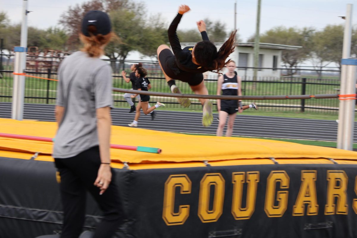 Jordyn Gilbert clears the high jump bar at the Cougar Relays meet at home earlier in the season. 
