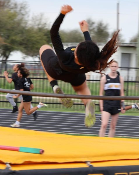 Jordyn Gilbert clears the high jump bar at the Cougar Relays meet at home earlier in the season. 